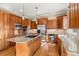 Well-equipped kitchen with stainless steel appliances, granite countertops, and abundant cabinet space for storage at 14958 Wistera Way, Broomfield, CO 80023