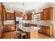Gourmet kitchen featuring stainless steel appliances, an island, and custom cabinetry for ample storage and style at 14958 Wistera Way, Broomfield, CO 80023