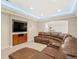 Entertainment room featuring a sectional sofa and a large screen TV at 14958 Wistera Way, Broomfield, CO 80023