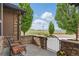 Charming stone patio with comfortable seating, offering scenic views of the surrounding landscape at 14958 Wistera Way, Broomfield, CO 80023