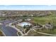Aerial view of the community pool, clubhouse, and amenities, set amongst manicured landscaping at 23252 E Glidden Dr, Aurora, CO 80016