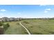 Expansive community green space with walking path, perfect for outdoor recreation and enjoying nature at 23252 E Glidden Dr, Aurora, CO 80016