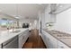 Bright and modern kitchen featuring stainless steel appliances, a center island, and lots of natural light at 23252 E Glidden Dr, Aurora, CO 80016