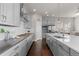 Modern kitchen featuring stainless steel appliances, a center island, and an open layout at 23252 E Glidden Dr, Aurora, CO 80016