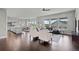 Spacious living area with open floor plan, featuring hardwood floors and ample natural light at 23252 E Glidden Dr, Aurora, CO 80016