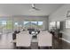 Bright and airy living room featuring hardwood floors, comfortable seating, and large windows at 23252 E Glidden Dr, Aurora, CO 80016