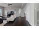 Open living room features hardwood floors, modern furniture, and a ceiling fan at 23252 E Glidden Dr, Aurora, CO 80016