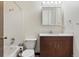 Bathroom featuring a white vanity, medicine cabinet, and tub-shower at 6650 E Arizona Ave # 203, Denver, CO 80224