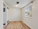 Bedroom with hardwood floors, neutral paint, and window for natural light at 6650 E Arizona Ave # 203, Denver, CO 80224