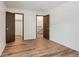 Bright bedroom boasts two large closets, luxury vinyl plank flooring, and fresh white paint at 6650 E Arizona Ave # 203, Denver, CO 80224