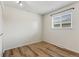 Cozy bedroom with vinyl plank flooring, freshly painted walls, and a bright window at 6650 E Arizona Ave # 203, Denver, CO 80224
