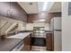 Well-equipped kitchen with stainless steel appliances and light fixtures at 6650 E Arizona Ave # 203, Denver, CO 80224