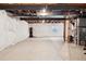 Large unfinished basement with exposed utilities and potential for a variety of uses at 4834 S Wenatchee St, Aurora, CO 80015
