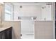 Modern bathroom featuring a glass shower with built-in shelving at 4834 S Wenatchee St, Aurora, CO 80015