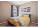 Comfortable bedroom features a bed and a window offering great natural light at 4834 S Wenatchee St, Aurora, CO 80015