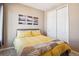 Comfortable bedroom features a bed, closet and a window offering great natural light at 4834 S Wenatchee St, Aurora, CO 80015