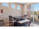 Eat-in dining area features a table, seating and sliding glass doors to the exterior at 4834 S Wenatchee St, Aurora, CO 80015