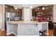 Well-equipped kitchen featuring granite counters, dark wood cabinets, and stainless steel appliances at 4834 S Wenatchee St, Aurora, CO 80015