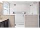 Modern bathroom showcasing a glass-enclosed shower with tiled walls and contemporary fixtures at 4834 S Wenatchee St, Aurora, CO 80015