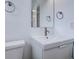 Small bathroom with white sink and vanity, toilet, and brushed nickel fixtures at 12866 E Ohio Ave, Aurora, CO 80012