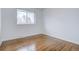 Spacious bedroom with hardwood floors and large window at 12866 E Ohio Ave, Aurora, CO 80012