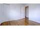 Simple bedroom with hardwood floors and closet at 12866 E Ohio Ave, Aurora, CO 80012