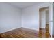 Spacious bedroom with hardwood floors and access to hallway at 12866 E Ohio Ave, Aurora, CO 80012