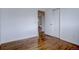 Well-lit bedroom with hardwood floors and access to another room at 12866 E Ohio Ave, Aurora, CO 80012