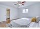 Bright bedroom with hardwood floors and ensuite bathroom at 12866 E Ohio Ave, Aurora, CO 80012