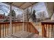 Wooden deck with railing, steps down to backyard, and view of the neighborhood at 12866 E Ohio Ave, Aurora, CO 80012