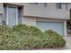 Partial view of home's entryway and garage, landscaping in front at 12866 E Ohio Ave, Aurora, CO 80012