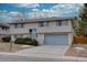 Ranch style home with attached garage and landscaped yard at 12866 E Ohio Ave, Aurora, CO 80012