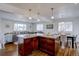 Open concept kitchen with granite island and breakfast bar at 12866 E Ohio Ave, Aurora, CO 80012