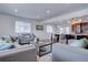 Open concept living room with kitchen and dining area views at 12866 E Ohio Ave, Aurora, CO 80012