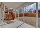 Covered patio with concrete flooring and wooden stairs leading to a deck at 12866 E Ohio Ave, Aurora, CO 80012