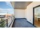 This contemporary balcony features a steel railing and lovely city views at 2400 S Delaware St # 1, Denver, CO 80223