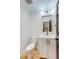 Stylish powder room featuring modern fixtures, clean lines, and a sleek vanity, providing a contemporary and functional space at 2400 S Delaware St # 1, Denver, CO 80223