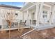 Relaxing back porch area with modern outdoor seating, perfect for enjoying the outdoors in comfort at 5984 Fulton St, Denver, CO 80238