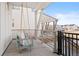 Charming front porch with a cozy swing, offering a relaxing spot to enjoy the neighborhood views at 5984 Fulton St, Denver, CO 80238