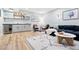 Finished basement has a entertainment area and sleek bar with modern fixtures and shelving at 5984 Fulton St, Denver, CO 80238