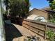 Narrow backyard with a wood fence and storage shed at 16180 E Flora Pl, Aurora, CO 80013
