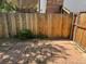 A sturdy wood fence offers privacy and security in this backyard, featuring brick pavers at 16180 E Flora Pl, Aurora, CO 80013
