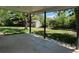 Relax on the covered patio overlooking a spacious backyard with a storage shed and mature trees at 16180 E Flora Pl, Aurora, CO 80013