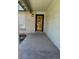 Home entrance featuring a wood door, brick accents and good lighting at 16180 E Flora Pl, Aurora, CO 80013