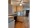 Kitchen area with a breakfast bar, wood cabinets and stainless steel appliances to create tasty meals at 16180 E Flora Pl, Aurora, CO 80013