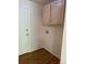 Laundry room with overhead storage and washer hookups at 16180 E Flora Pl, Aurora, CO 80013