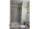 Bathroom featuring a tiled walk-in shower at 16180 E Flora Pl, Aurora, CO 80013