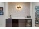 A modern bar with white counters, a sink, wine fridge and fun decor at 1763 S Williams St, Denver, CO 80210