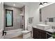 Modern bathroom with stylish tilework, glass shower, and floating vanity at 1763 S Williams St, Denver, CO 80210