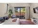Relaxing bedroom with balcony, outdoor view, and stylish furniture at 1763 S Williams St, Denver, CO 80210